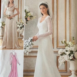 May include: A white ceramic mug with a black handle and the text "But First, Coffee" in a black, handwritten-style font. The mug is on a white surface.