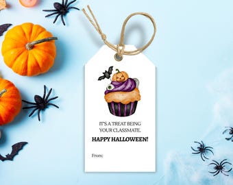 May include: A Halloween-themed gift tag with a watercolor cupcake illustration, a bat, and a pumpkin. The tag reads "IT'S A TREAT BEING YOUR CLASSMATE. HAPPY HALLOWEEN!" with space for a "From:" message. The background includes pumpkins and spiders.
