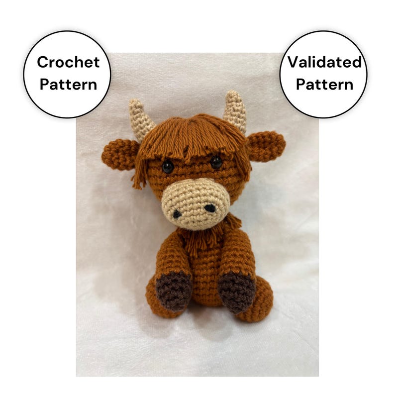 May include: A crocheted Highland cow plushie in shades of brown, tan, and black. The handmade stuffed animal features a shaggy mane, horns, and a round body. The image includes text that says "Crochet Pattern" and "Validated Pattern".