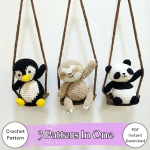 May include: Three crocheted animal toys: a penguin, a sloth, and a panda, each on a swing made of brown rope. The penguin is black and white with a yellow beak and feet. The sloth is tan, and the panda is black and white. Text reads "3 Patterns In One".