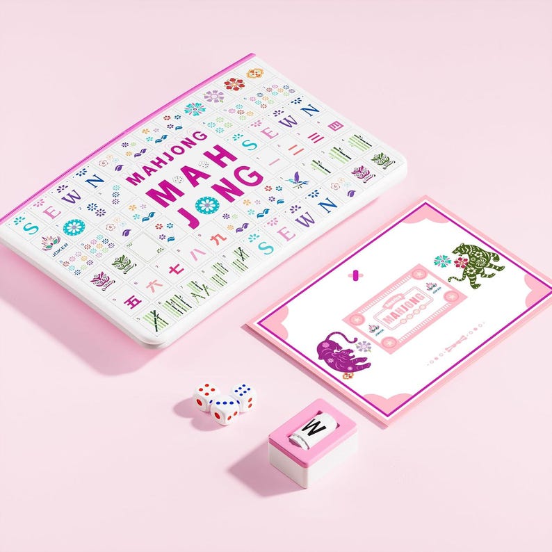 May include: A Mahjong game set featuring a white rectangular board with colorful printed tiles, text reading MAHJONG, and the word SEWN. Includes a rectangular instruction card with tiger illustrations, three white dice, and a single letter W tile.