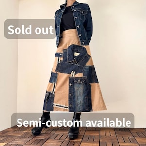 May include: A dark blue denim jacket and a long skirt with denim patches. The skirt is beige with dark blue denim patches. The text "Sold out" and "Semi-custom available" are visible.