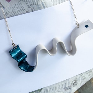 Porcelain squiggle statement necklace with metallic teal accents