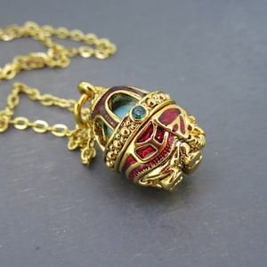 Vintage Jeweled Joan Rivers Caged Egg Pendant Necklace with Guilloche Enamel, Rhinestones, and Caged Ball on 18&quot; Gold Tone Chain