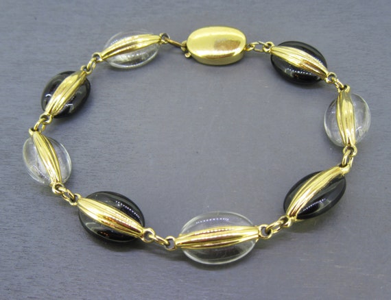 Swarovski black hotsell and gold bracelet