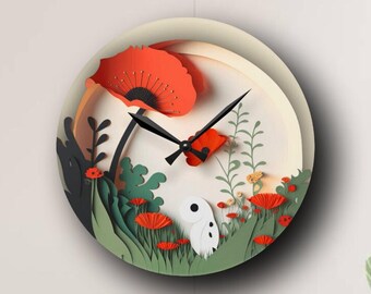 May include: A round wall clock with a layered paper design. The clock face features a whimsical garden scene with red poppies, green foliage, and a white creature. Black clock hands and a red accent complete the design.