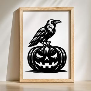 May include: Black and white framed art print featuring a raven perched atop a carved jack-o'-lantern. The raven is detailed with textured feathers, and the pumpkin has a grinning face. The artwork is set against a white background within a light wood frame.