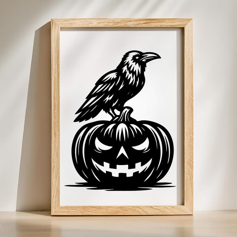 May include: Black and white framed art print featuring a raven perched atop a carved jack-o'-lantern. The raven is detailed with textured feathers, and the pumpkin has a grinning face. The artwork is set against a white background within a light wood frame.