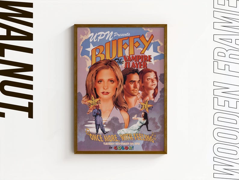 May include: A framed poster for "Buffy the Vampire Slayer" with a wooden frame. The poster features images of the main characters and the text "ONCE MORE, WITH FEELING" and "IN COLOR!"