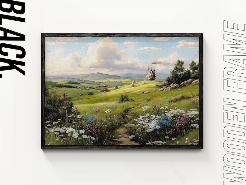 May include: A framed landscape painting depicts a vibrant green meadow with a stone path leading towards a distant hill. A whimsical, moving structure emits smoke. The sky is a mix of blue and white clouds, and the frame is black.