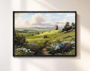 May include: A framed landscape painting depicts a vibrant green field with a stone path leading towards a distant structure. The sky is filled with fluffy clouds, and wildflowers dot the foreground. The artwork is framed in a black wooden frame.