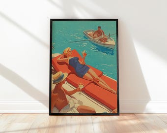 May include: Framed vintage-style print depicting a sunny day by the water. A woman in a blue dress reclines on a red lounge chair, holding a cocktail. Another person in a straw hat and a man in a rowboat are also visible. The artwork has a retro aesthetic.