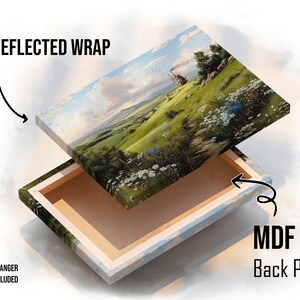 May include: A canvas print featuring a landscape painting with green hills, white flowers, and a blue sky. The print has a reflected wrap and an MDF back panel. A sawtooth hanger is included.