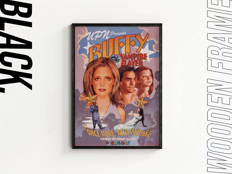 May include: A framed poster for "Buffy the Vampire Slayer" with a black wooden frame. The poster features images of the main characters and the text "Once More With Feeling" and "In Color!" The UPN logo is at the top.
