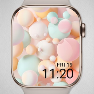 May include: A close-up of a smartwatch with a pastel-colored bubble design on the screen. The watch face displays the date, Friday the 19th, and the time, 11:20. The watch has a silver-colored case and a light-colored band.