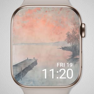 Könnte beinhalten: Eine Smartwatch mit einem Display im Landschaftsstil. Der Bildschirm zeigt ein Aquarellgemälde einer Seeszene mit Steg, Bäumen und einem rosa-orangenen Himmel. Die Uhrzeit ist 11:20 Uhr, und das Datum ist Freitag, der 19.