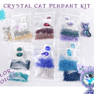 May include: Crystal cat pendant kit with various color choices. The image shows several small bags filled with beads and crystals in different colors, including silver, gold, red, green, blue, and purple. The text "COLOR CHOICE!!" is visible.