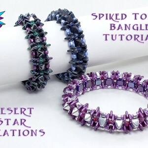 May include: Three beaded bracelets in different color combinations. The bracelets are made with small, faceted beads in shades of purple, blue, green, and silver. The bracelets are arranged on a white surface with the text "SPIKED TOWER BANGLES TUTORIAL" and "DESERT STAR CREATIONS" visible.