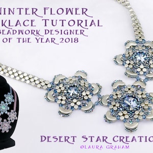 May include: A silver and blue beaded necklace with three flower-shaped pendants. The necklace is on a black mannequin. The text "WINTER FLOWER NECKLACE TUTORIAL BEADWORK DESIGNER OF THE YEAR 2018 DESERT STAR CREATIONS OLAURA GRAHAM" is on the image.