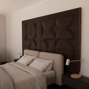 May include: A bedroom with a modern design featuring a large, dark brown, wave-patterned headboard. The bed has a beige headboard, white pillows, and a patterned blanket. A white lamp sits on a black nightstand.