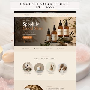 Könnte beinhalten: Eine Website-Oberfläche für Pure Rituals Skincare mit einem Hero-Bereich mit bernsteinfarbenen Glastropfflaschen, dem Text Spookily Good Skin und einem Shop By Category-Bereich mit Symbolen für Reiniger, Kerzen, Keramik und Geschenke.