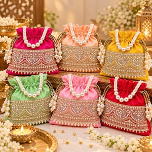 May include: Six drawstring pouches in fuchsia, peach, yellow, light green, pink, and red satin. Each bag features a white pearl handle, gold metallic embroidery, and intricate beadwork in a scalloped pattern along the lower section.