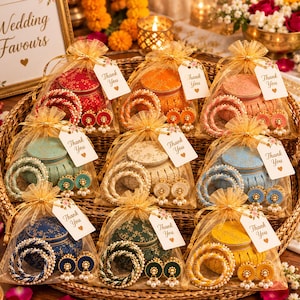 May include: Nine gift bags made of gold organza, each containing a small round container, two bangles, and a pair of earrings. Each bag features a white tag with the text Thank You and a heart icon, showcasing various colors like red, orange, pink, teal, white, blue, dark blue, green, and yellow.