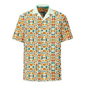 May include: Short-sleeved shirt with a vibrant geometric design in orange, teal, and cream. It has a light green collar and a patterned inner collar. A distinctive and fashionable item of clothing.