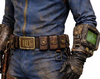 May include: A blue jumpsuit with the number "101" printed on the chest and belt buckle. The outfit includes a brown leather belt with pouches, shoulder armor, and a wrist-mounted device with a green screen. The overall aesthetic is distressed.