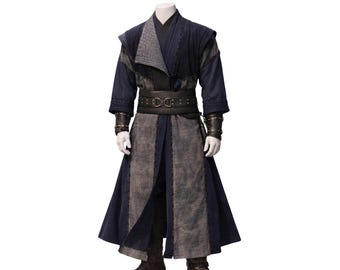 May include: A dark blue costume with a layered design, featuring a long coat and a wide belt. The costume has gray accents and leather wrist cuffs. The outfit is displayed on a mannequin.