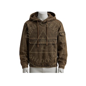 May include: Brown hooded sweatshirt with a drawstring and front pockets. The sweatshirt has the words "DENIM SEW SHADOWS" printed on it. The garment is made of a textured fabric and has a relaxed fit.