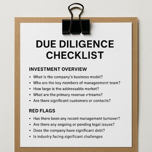 May include: A clipboard with a white checklist titled "DUE DILIGENCE CHECKLIST" in bold black font. The checklist includes sections for "INVESTMENT OVERVIEW" and "RED FLAGS", with bullet points listing key questions for business analysis. A black clip holds the paper.