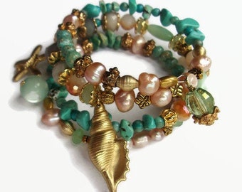 Sea charm memory wire wrap bracelet with pearls, stone chips and seashell charms in aqua blue, green and pale pink