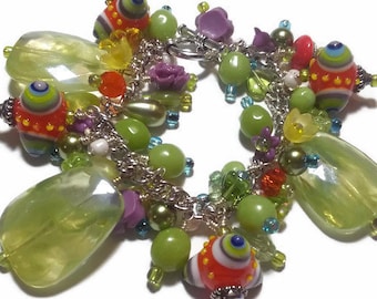 Beaded charm bracelet in lime green, orange, purple and yellow, chunky charm bracelet, cluster bracelet in bright colors, bead charms,