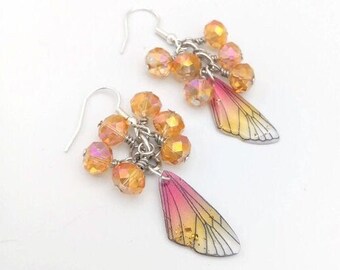 Sparkly butterfly wing charm earrings in red, yellow and flecks of gold and clusters of golden yellow faceted beads,  clip-ons available,