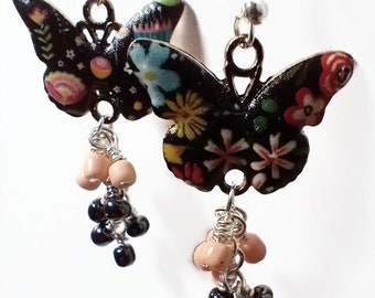 Floral butterfly earrings with pink and black bead clusters
