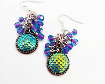 Blue iridescent scale earrings with purple bead clusters, clip-ons available