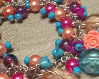 Pink, peach and blue cha cha bracelet in 80's colors