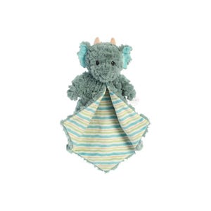 a stuffed elephant is wrapped in a blanket