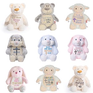 May include: A collection of nine plush stuffed animals including bears, lambs, and bunnies. Each toy features personalized embroidery on the chest, displaying names, dates, and religious symbols like crosses, with text such as God Bless, First Communion, and Baptized.
