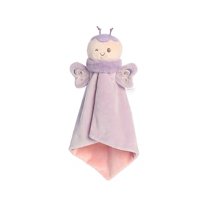 a stuffed toy angel hanging on a wall