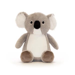 A stuffed koala bear toy with a white belly and brown ears sits on a white background.