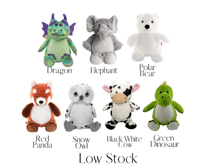A collection of stuffed animals, including a dragon, elephant, polar bear, red panda, owl, cow, black and white cow, and green dinosaur, arranged in a grid-like pattern.