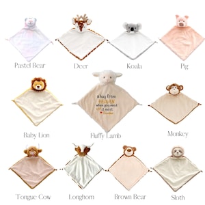 May include: A collection of ten baby security blankets, each featuring a different animal head and a soft, square body. Animals include a bear, deer, koala, pig, lion, lamb, monkey, cow, and sloth. The "Fluffy Lamb" blanket has embroidered text.