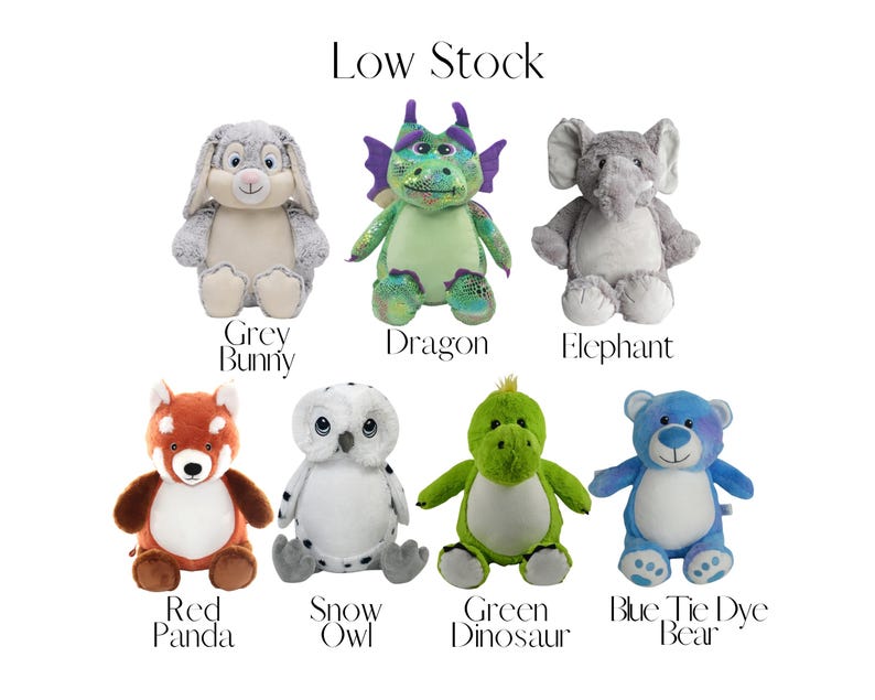 a collection of stuffed animals, including a panda, rabbit, dragon, elephant, panda, owl, snow owl, green dinosaur, and blue tie dye bear.