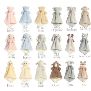May include: Collection of plush animal security blankets in various colors, including pink, blue, beige, and gray. Each blanket features a different animal head, such as a bear, bunny, elephant, or fox, with a soft, square body.