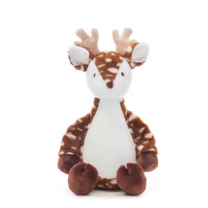 A plush toy of a deer with antlers sits against a white background.