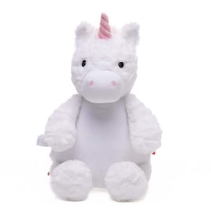 A white plush unicorn toy with a pink horn and tail sits against a white background.