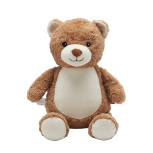 A brown and white stuffed teddy bear sitting against a white background.