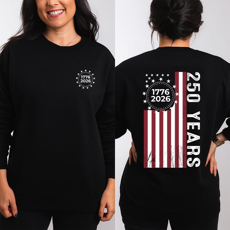 May include: Black sweatshirt with a white graphic on the front that says "1776 2026" inside a circle of stars. The back features a vertical American flag design with the text "250 YEARS".